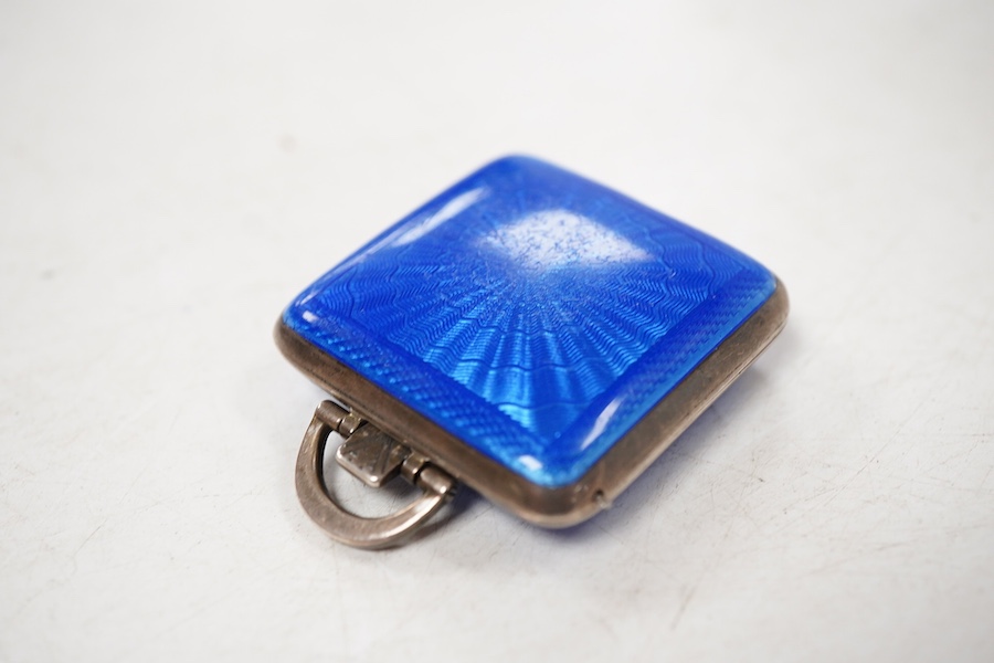 A George V silver and blue guilloche enamel travelling folding timepiece, maker SSM, Birmingham, 1931, with Arabic dial and subsidiary seconds, case diameter 37mm, enamel a.f.